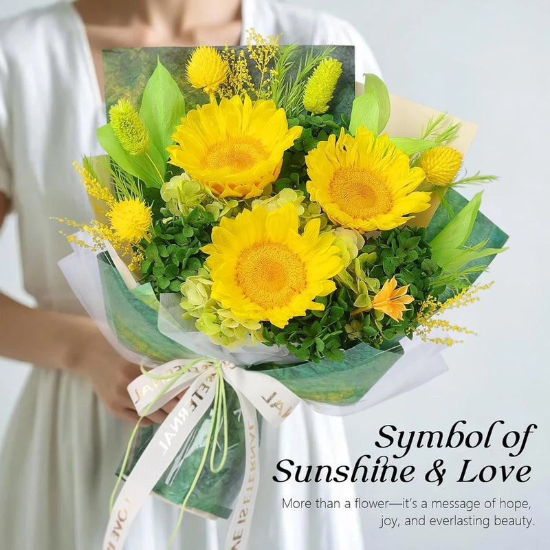 Yellow sunflower bouquet with green leaves, wrapped in light green paper and ribbon