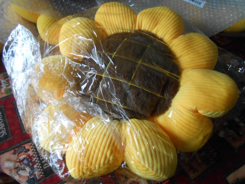 Sunflower decorative pillow with black center and yellow ribbed petals
