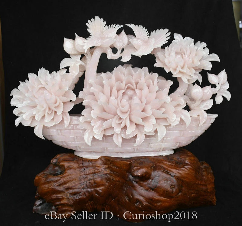 Peony flower bird sculpture with pale pink blossoms and carved dark wood-like base