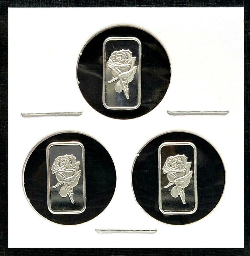 Set of three 1g fine silver rose bars in round black holders