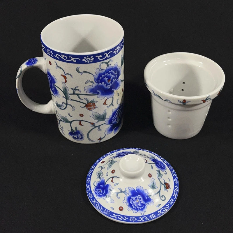 Blue and white peony tea infuser mug with matching lid strainer, ceramic teacup style