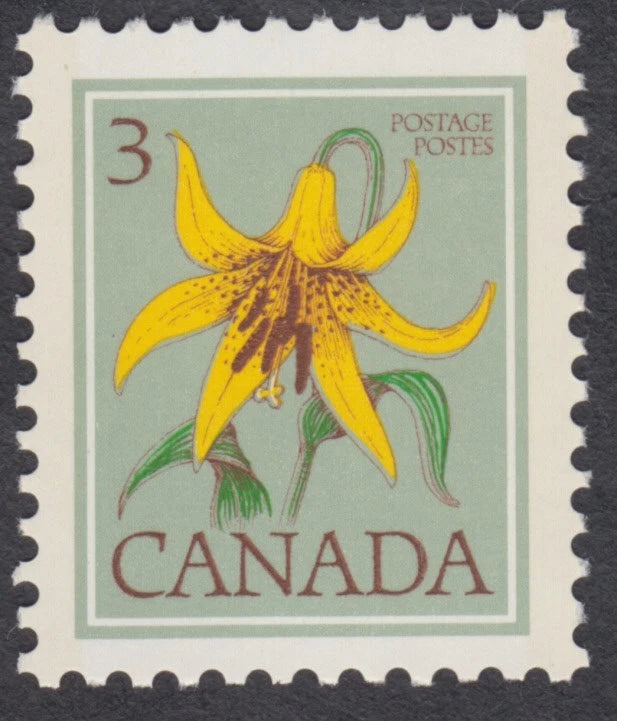 Canadian postage stamp with a yellow lily flower and 'CANADA' text