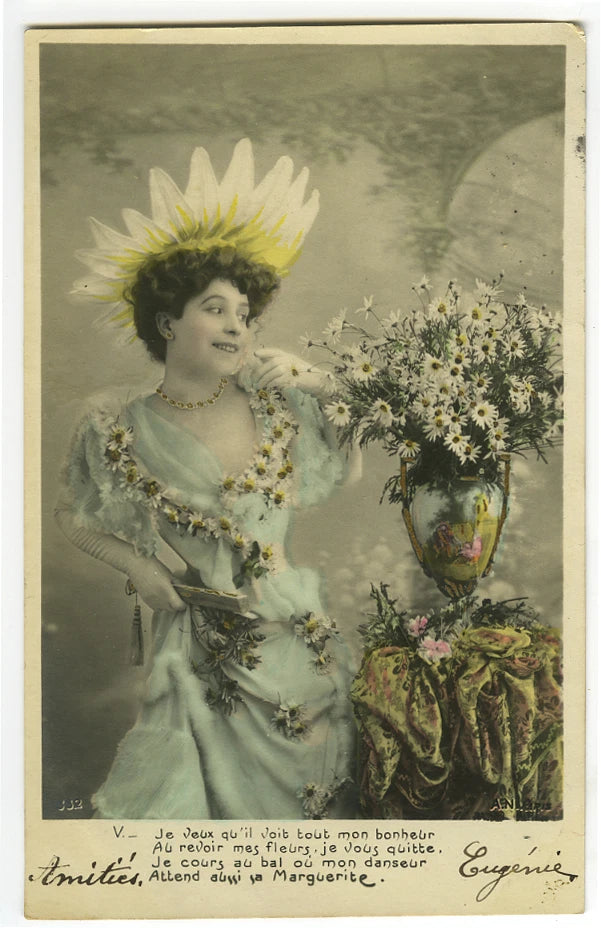 Vintage tinted photo postcard featuring a woman holding a sunflower bouquet