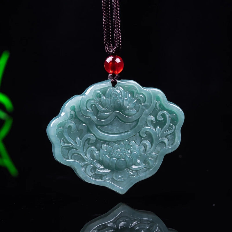 Blue-green jadeite ruyi lock pendant with peony carving, red bead bail and cord