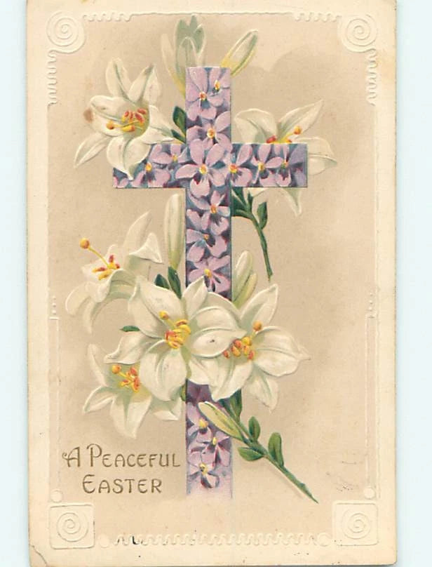 Decorative linen-style Easter cross with violet flowers and white lily blossoms