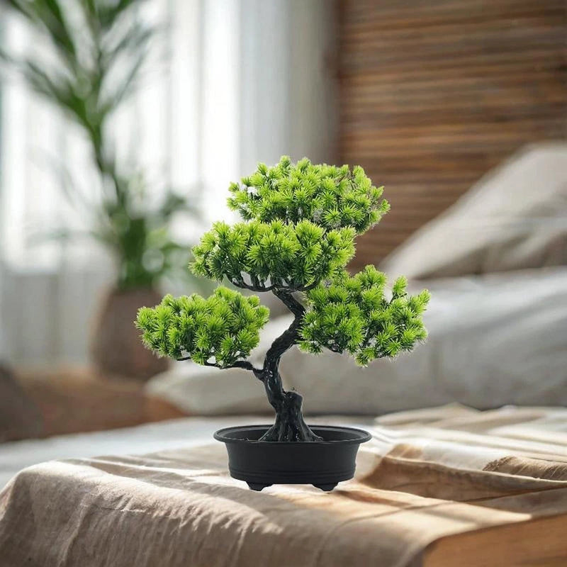 Artificial bonsai tree in black pot with bright green clustered foliage