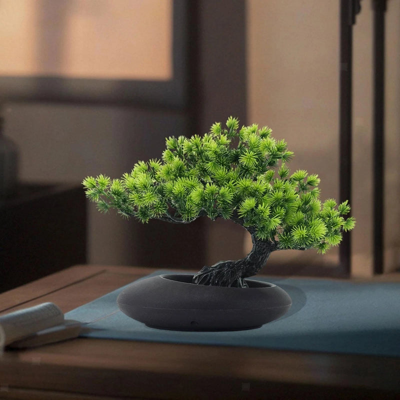 Artificial bonsai tree with bright green needle-like leaves in dark round pot