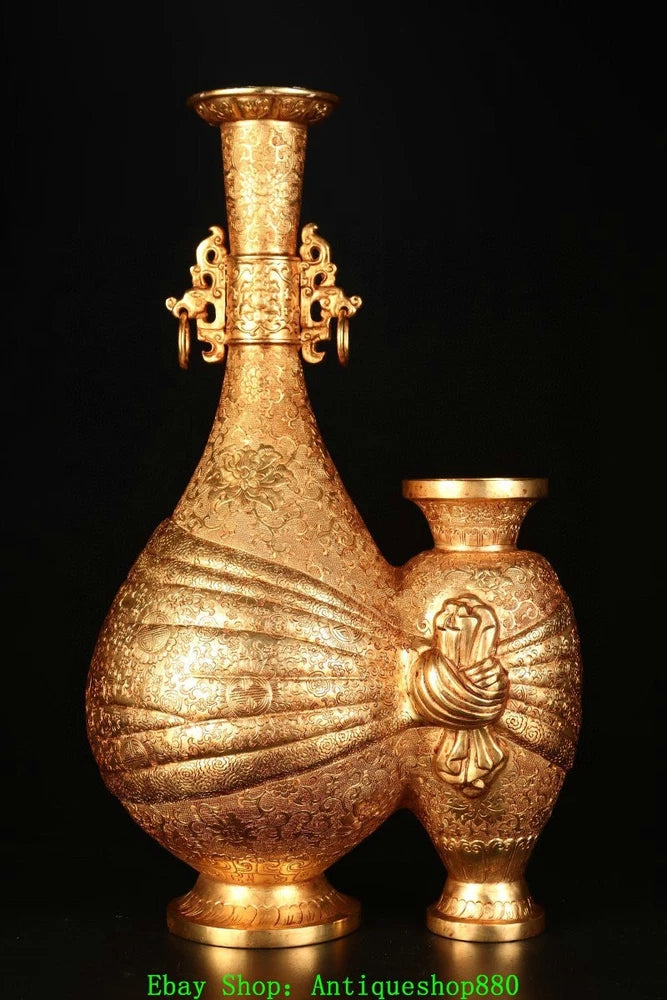 Gold bronze decorative vase with embossed floral pattern and two bulbous body sections