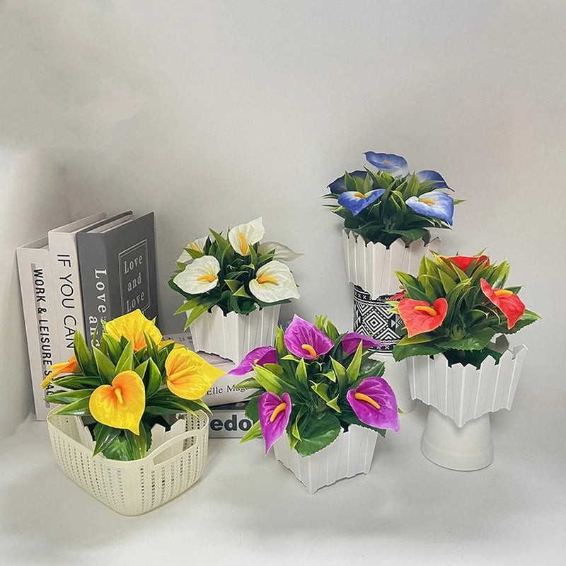 Calla lily flower arrangements in white ribbed pots with mixed flower colors