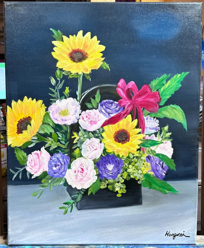 Canvas painting of a flower bouquet in a basket with sunflowers, pink, blue, and white blooms