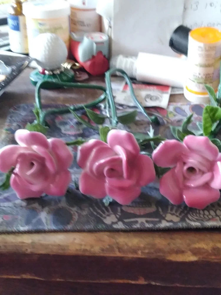 Three pink porcelain rose flowers with plastic stems