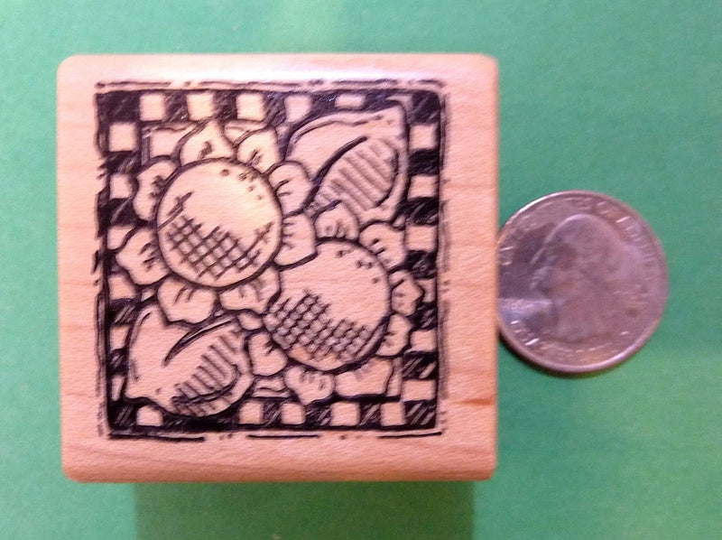 Wood-mounted rubber stamp with sunflower motif on square wooden block