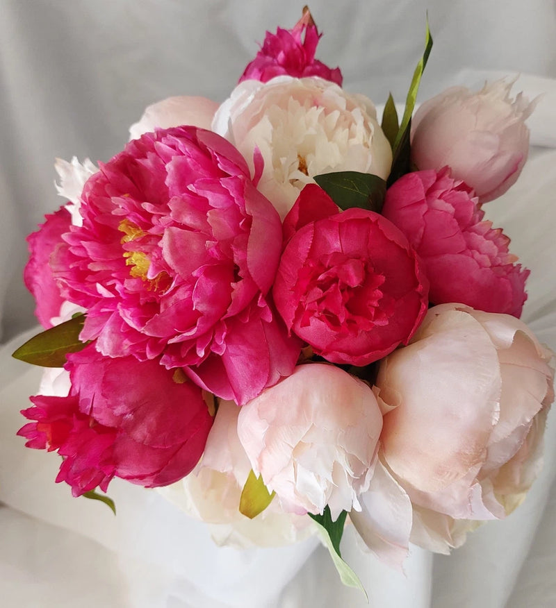 Pink and white peony bridal wedding bouquet with dark pink flowers