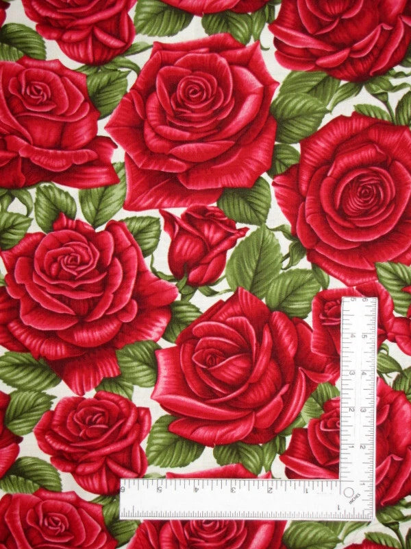 Cream cotton fabric with red rose floral print and stitched leaves; includes measuring ruler