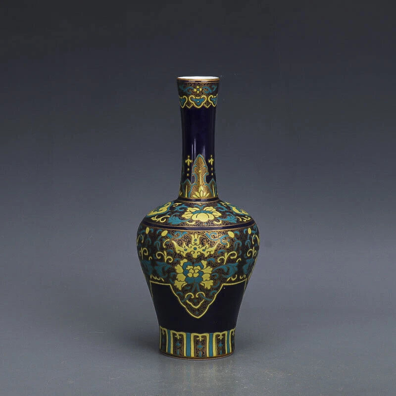 Blue porcelain vase with gold gilt accents and decorative floral pattern