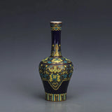 Blue porcelain vase with gold gilt accents and decorative floral pattern