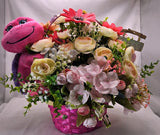 Whimsical Stuffed Turtle Flower Centerpiece in Pink Basket of Flowers - Tropical Ranunculus