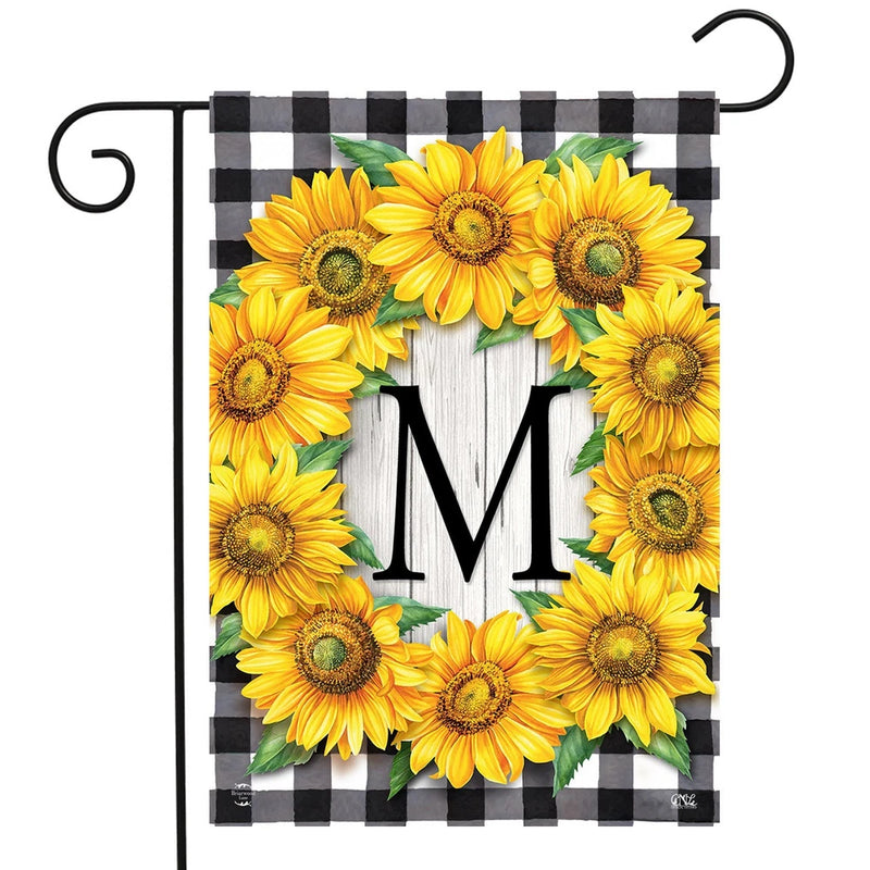 Garden flag with sunflower wreath and monogram M, framed by black check border