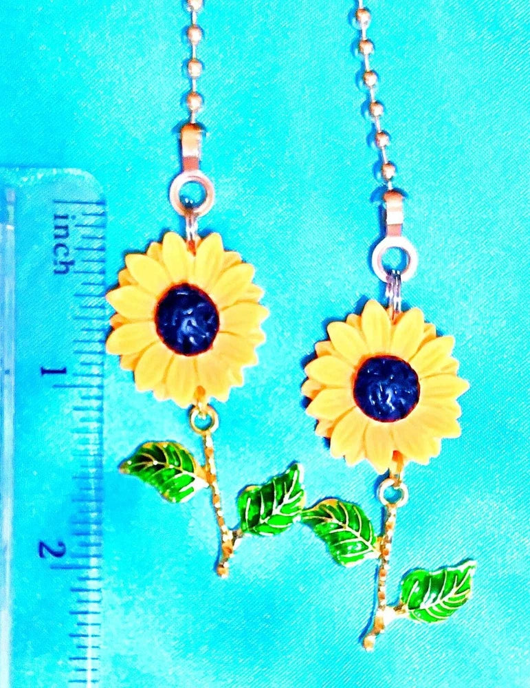 Set of two yellow sunflower ceiling fan pull chains with metal flower charms