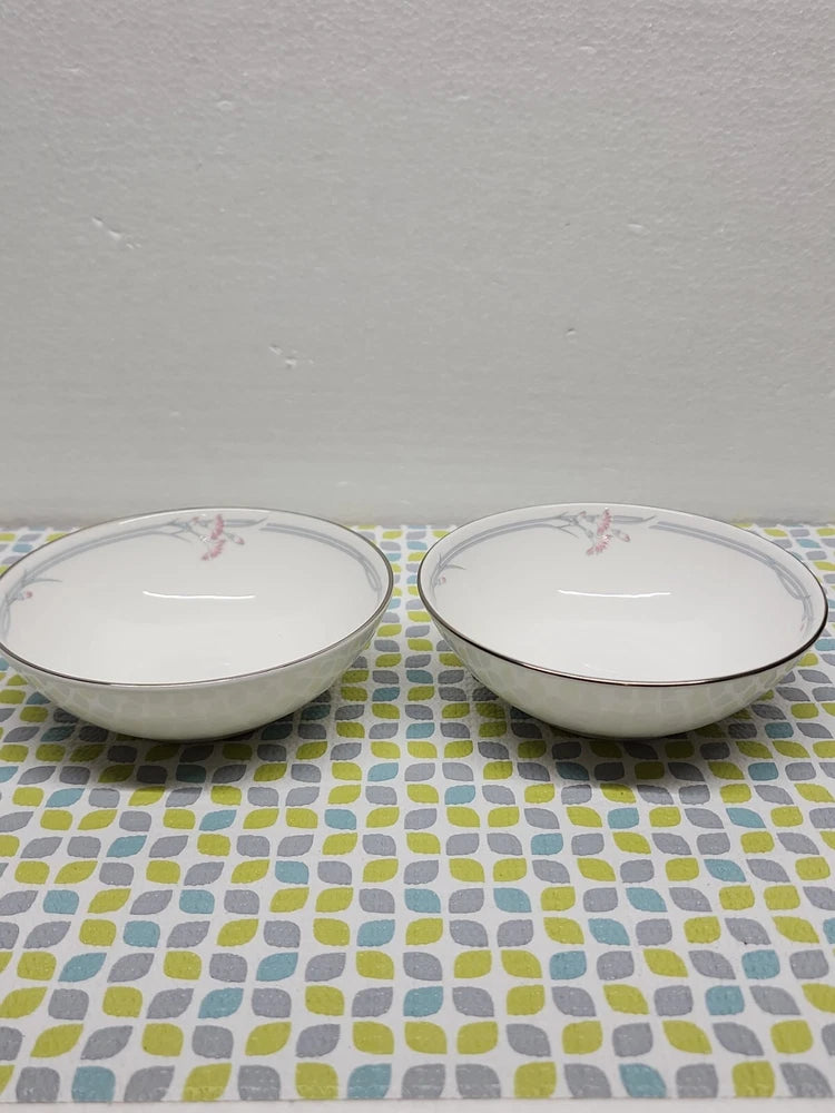 Set of 2 ceramic dessert bowls, white with floral accents and gray rim band.
