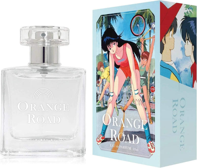 Clear glass eau de parfum bottle with rounded cap and Orange Road label