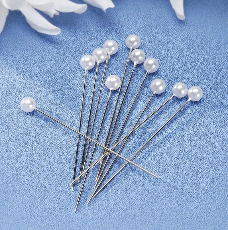 White round pearl head boutonniere pins on thin metal stems