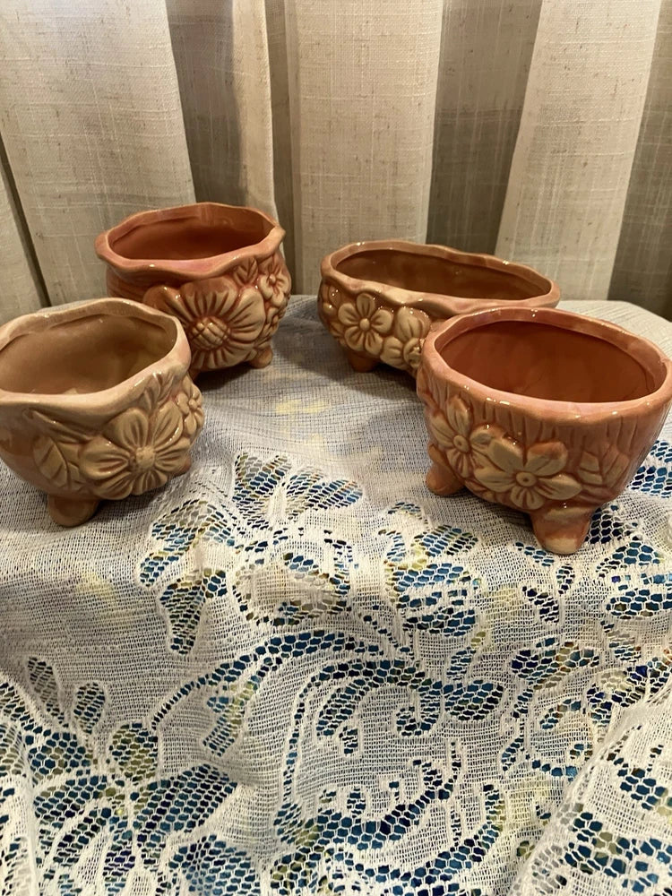 Set of 4 ceramic planter pots with floral embossed handles, terracotta brown color