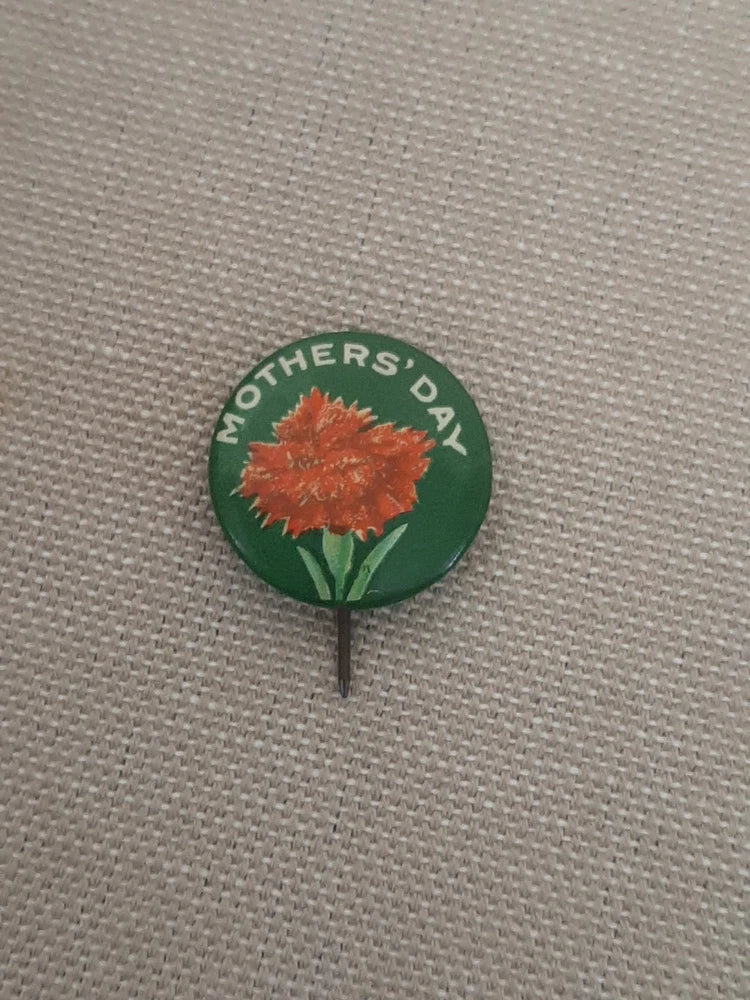 Mother’s Day pinback button with green border and orange carnation flower graphic