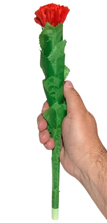 Red carnation flower prop with green stem held in hand
