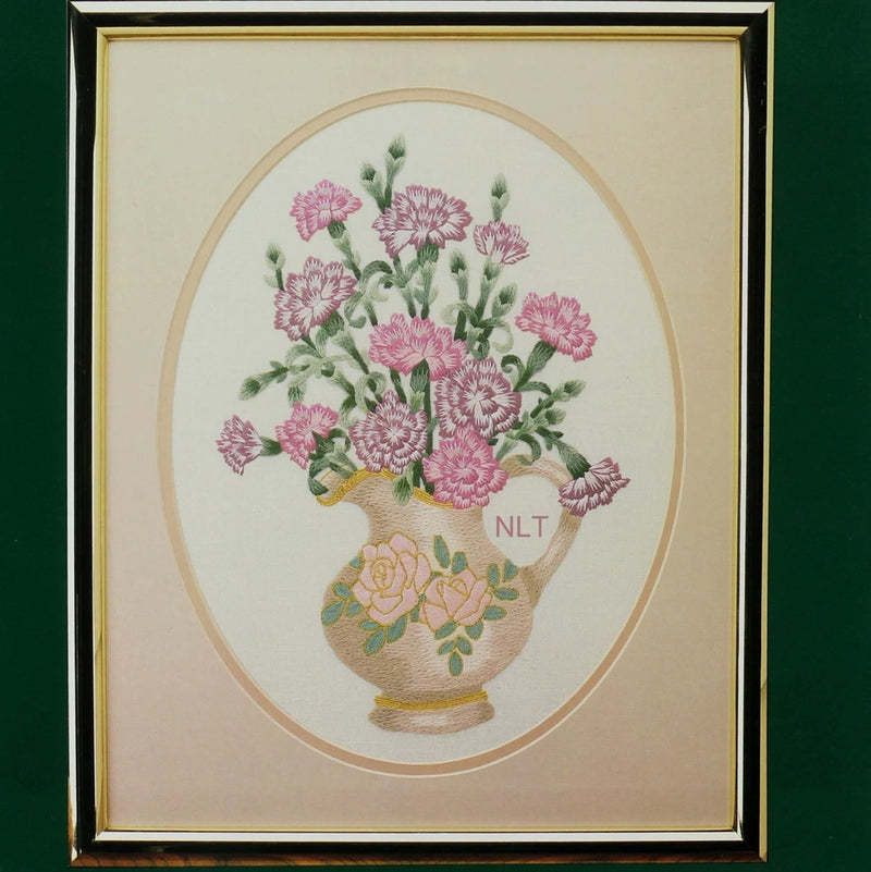 Framed crewel embroidery of pink carnation bouquet in a vase pitcher
