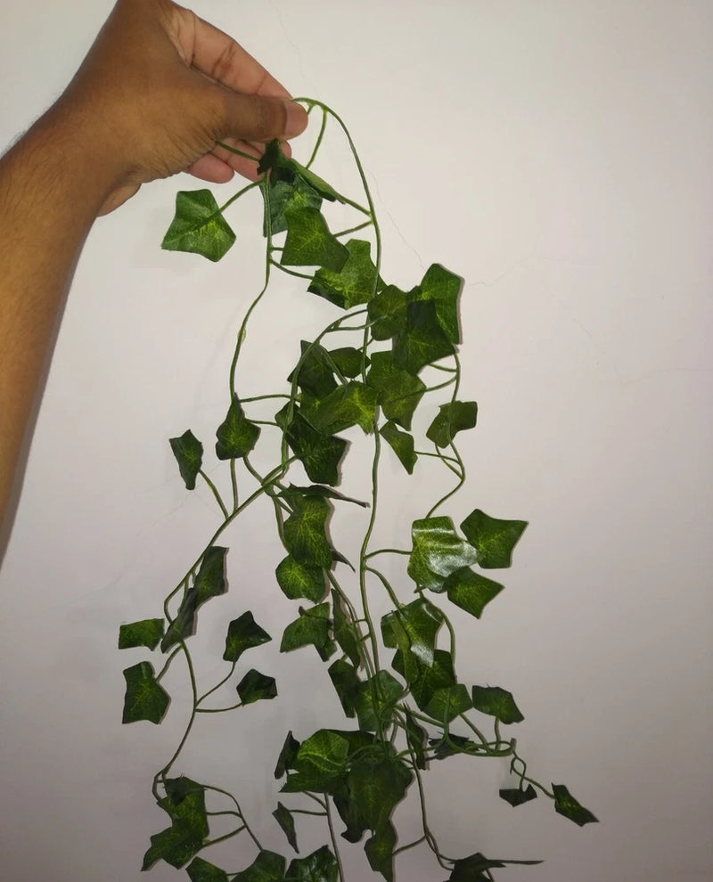 Artificial ivy vine garland with green leaf clusters on flexible hanging stems