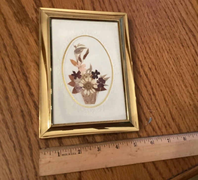 Pressed flower bouquet in gold 5x7 frame with oval floral arrangement on white mat