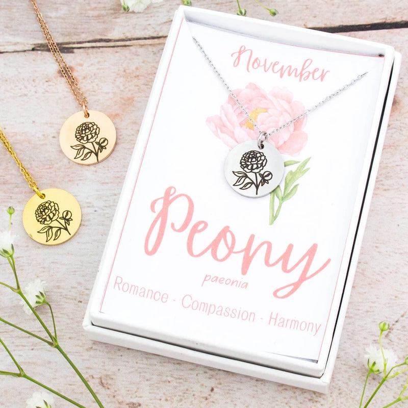 Gold peony pendant necklace with round engraved floral charm on chain