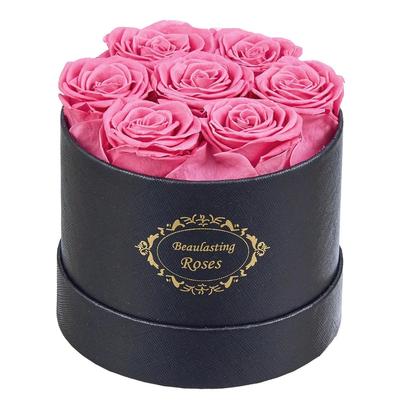 Long-lasting rose gift box: pink preserved roses in black round case with gold logo