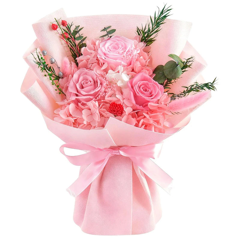 Pink rose bouquet with red accents, wrapped in pink paper and tied with ribbon