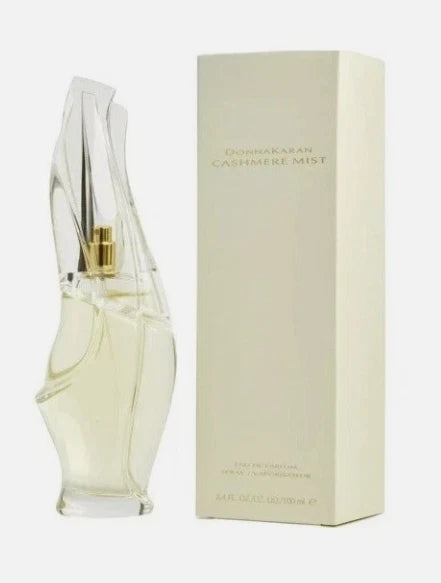 Women's eau de parfum bottle with clear glass, gold cap, and cream box packaging