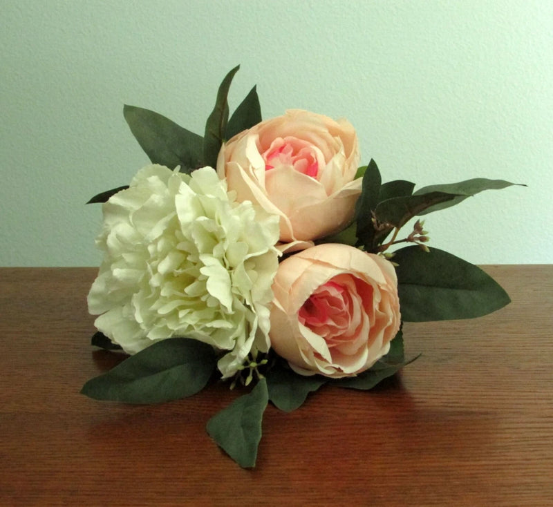Silk flower wedding bouquet with cream roses, white blooms, and eucalyptus leaves