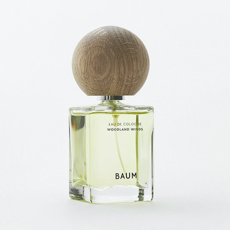 SHISEIDO BAUM Eau de Cologne Woodland Winds bottle with clear green glass and round wood-toned cap