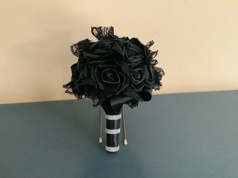 Black lace and rose wedding bouquet with wrapped handle and dangling ribbons
