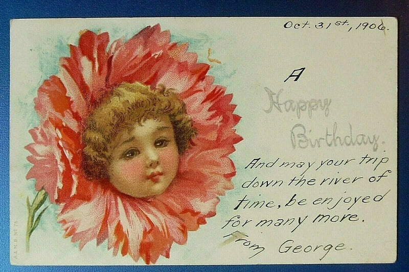 Antique birthday postcard with child face in pink carnation and handwritten message