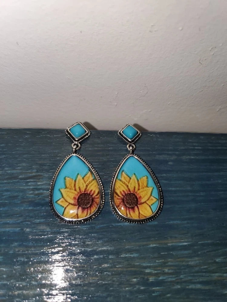 Teardrop sunflower earrings with blue square tops and yellow flower enamel