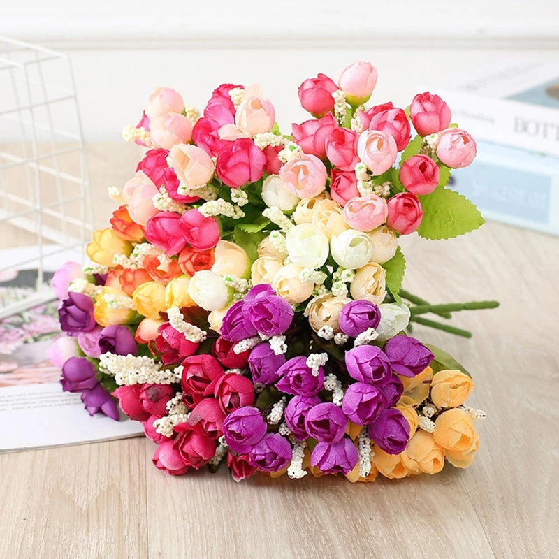 Artificial rose bouquet with mixed pink, purple, cream blooms and green leaves