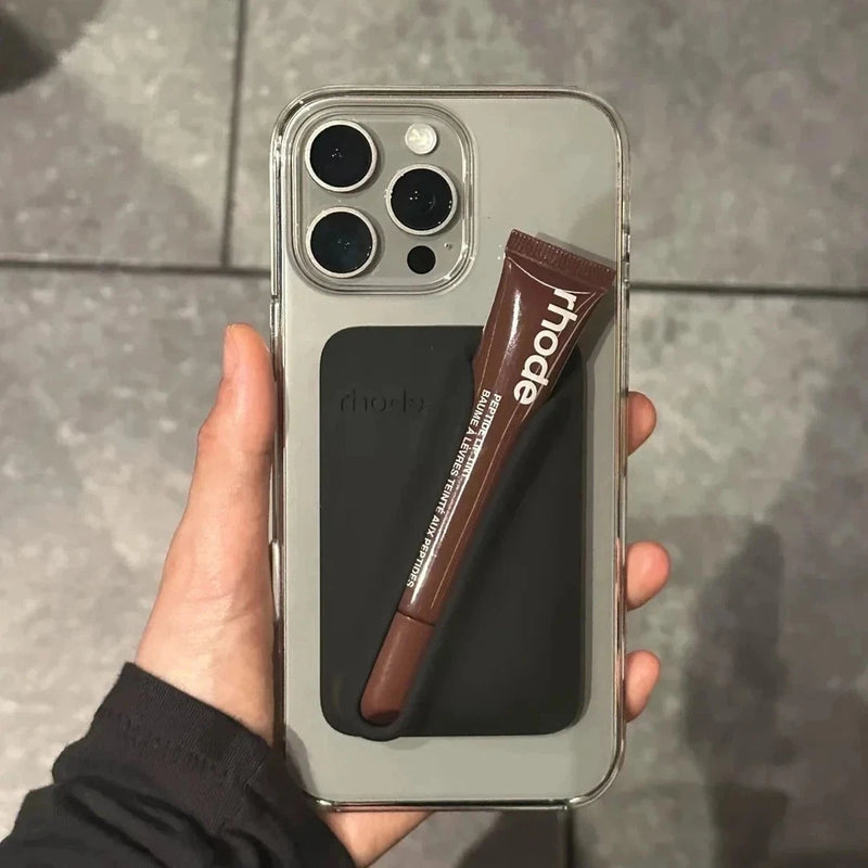 Clear iPhone case with snap-on lip gloss holder; brown gloss with Rhode label