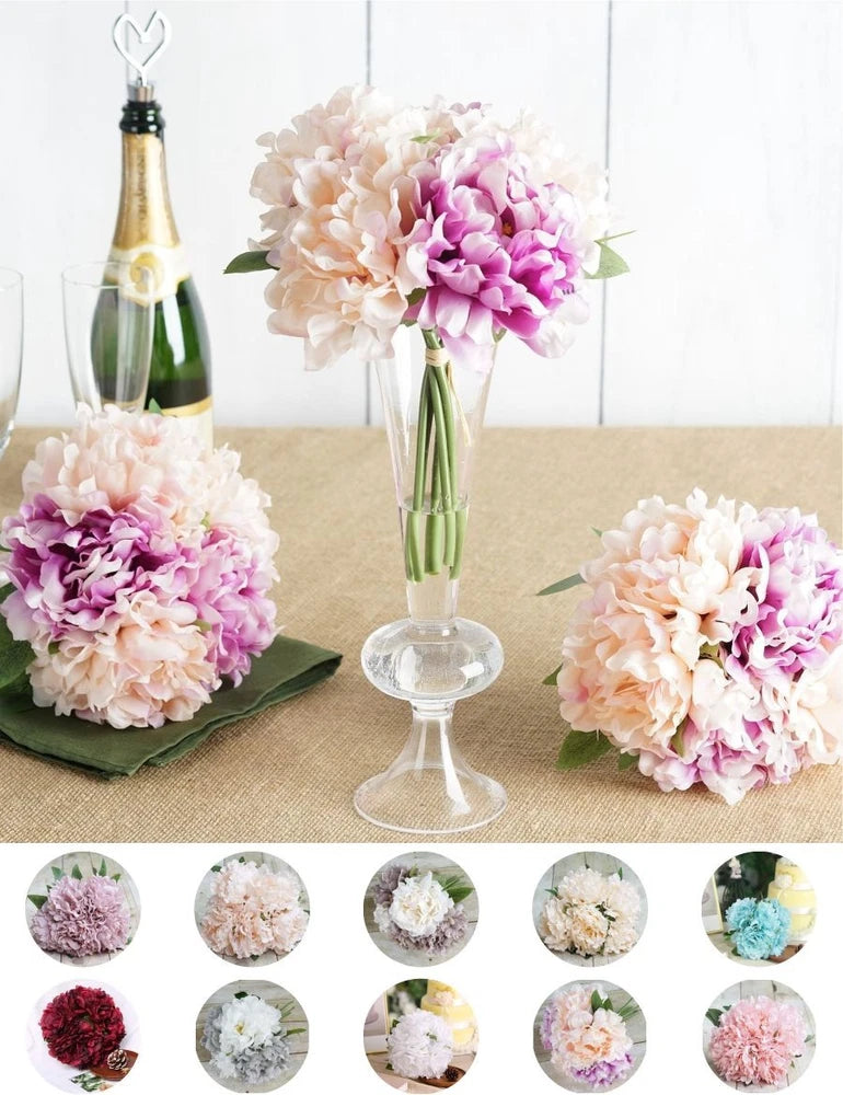 Artificial peony flower bouquet with pink and purple blooms in clear glass vase