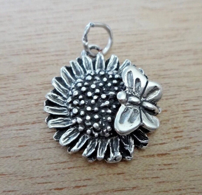 Sterling silver sunflower charm with detailed center and small butterfly, loop top bail
