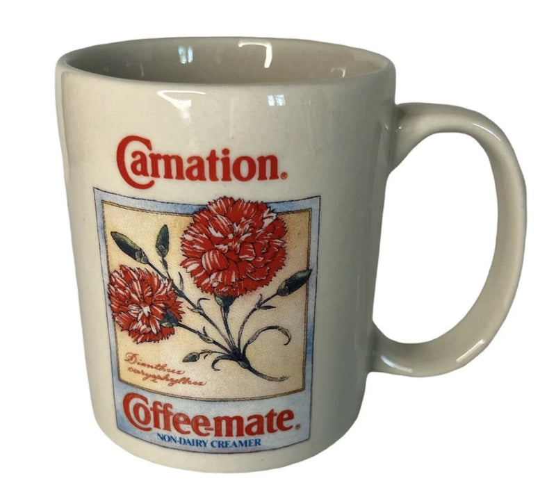 Vintage ceramic coffee mug with Carnation and Coffeemate logos, floral botanical print