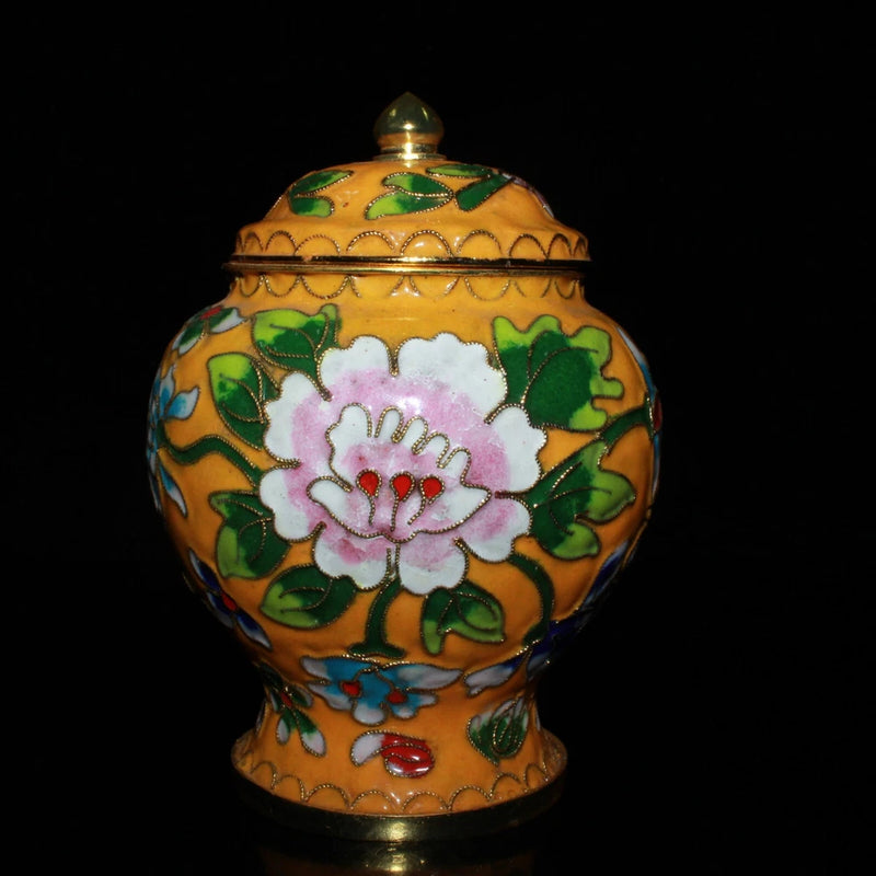 Decorative cloisonne lidded jar with pink peony, green leaves, gold trim and finial