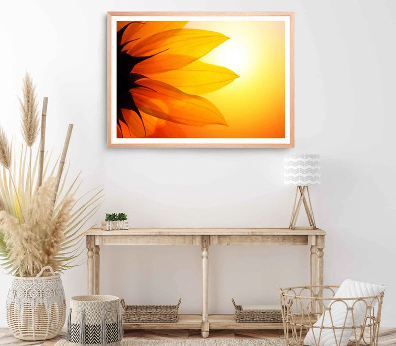 Framed sunflower petals wall art print with orange and yellow petals