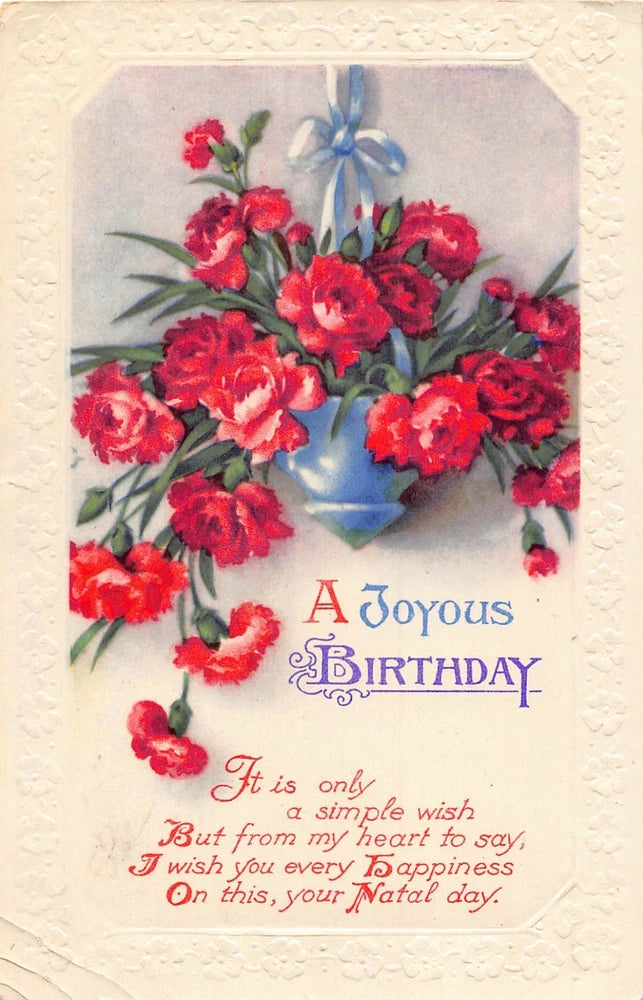 Vintage birthday postcard with red carnations in a blue hanging vase and ribbon
