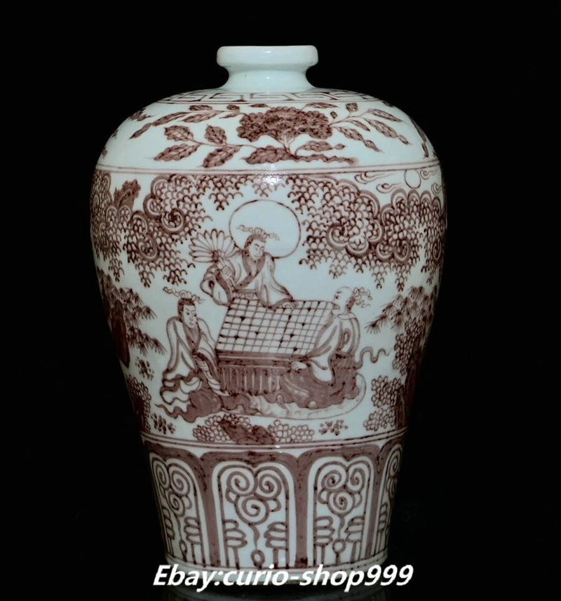 White porcelain story bottle vase with red floral scrollwork, seated figures, and lid
